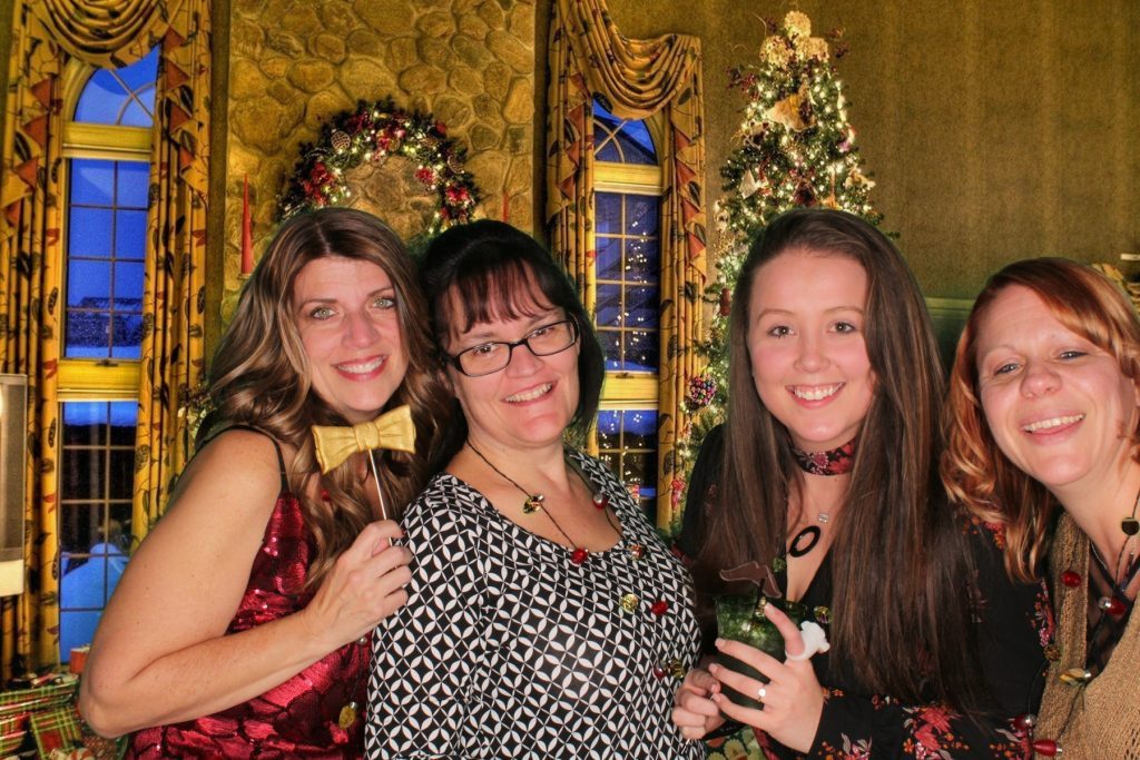 4 Women Taking Picture From Selfie Booth